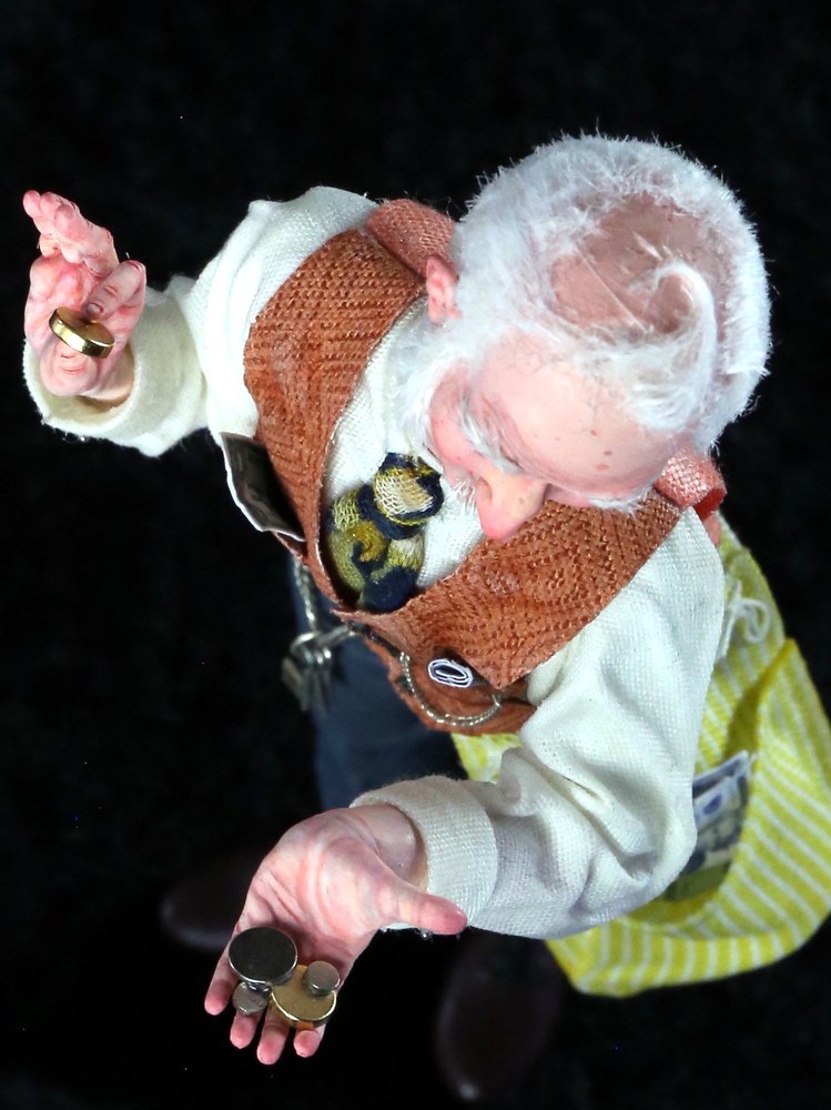 Detail — hand with playing cards